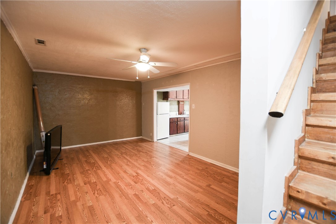 153 Deer Trail Aylett, VA 23009 - Photo 22 of 50 a view of empty room with wooden floor and fan