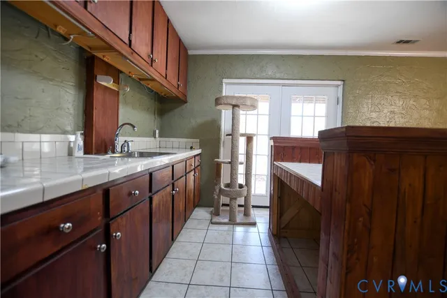 a close view of a sink and dishwasher in a refrigerator