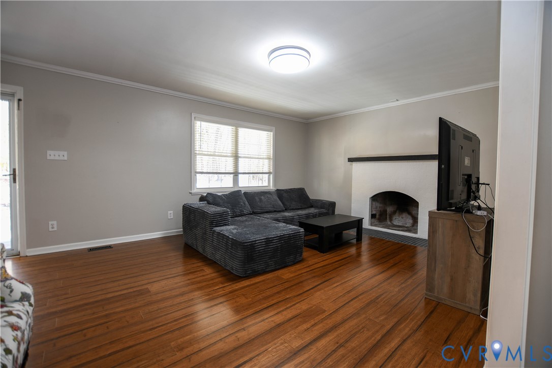 153 Deer Trail Aylett, VA 23009 - Photo 7 of 50 a living room with furniture and a fireplace