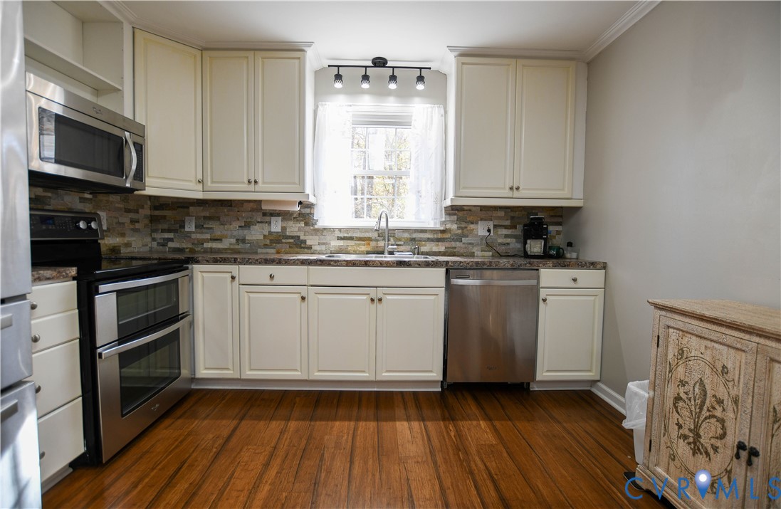 153 Deer Trail Aylett, VA 23009 - Photo 9 of 50 a kitchen with a sink stove and cabinets