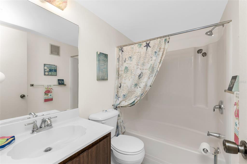 25225 Rampart Boulevard, Unit 1604 Punta Gorda, FL 33983 - Photo 20 of 41 a bathroom with a sink a toilet and a bathtub