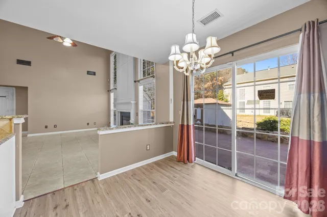 a kitchen with stainless steel appliances granite countertop a stove microwave and cabinets