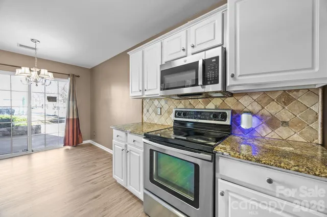 a bathroom with a sink vanity and a mirror