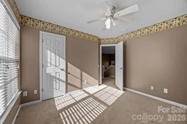 a view of a barn in the middle of a yard