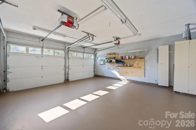 a view of a house with a yard and garage