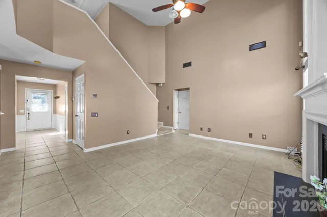 a view of a kitchen with a sink and a refrigerator