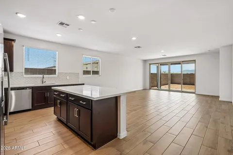 a kitchen with stainless steel appliances granite countertop a stove and a sink