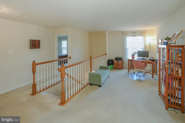 a view of an empty room with stairs