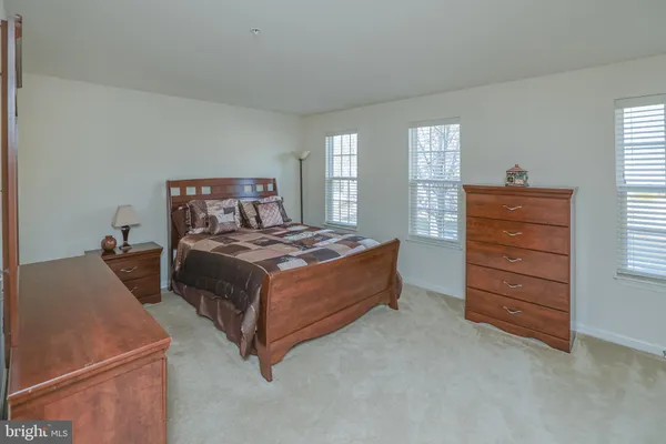 a bed room with a bed and a window