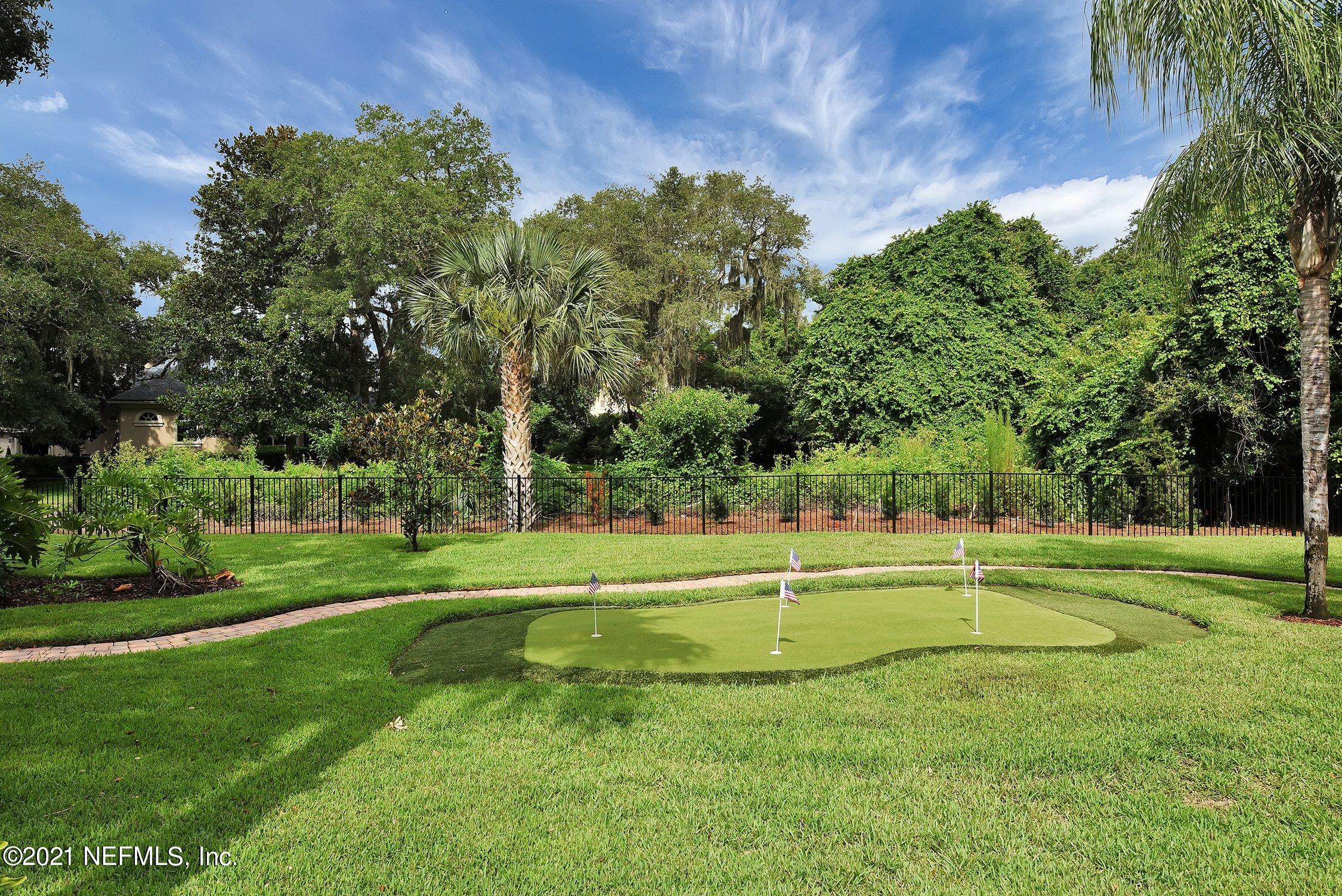 142 Marshall Creek Drive St. Augustine, FL 32095 - Photo 103 of 176 a view of a big yard with a large trees