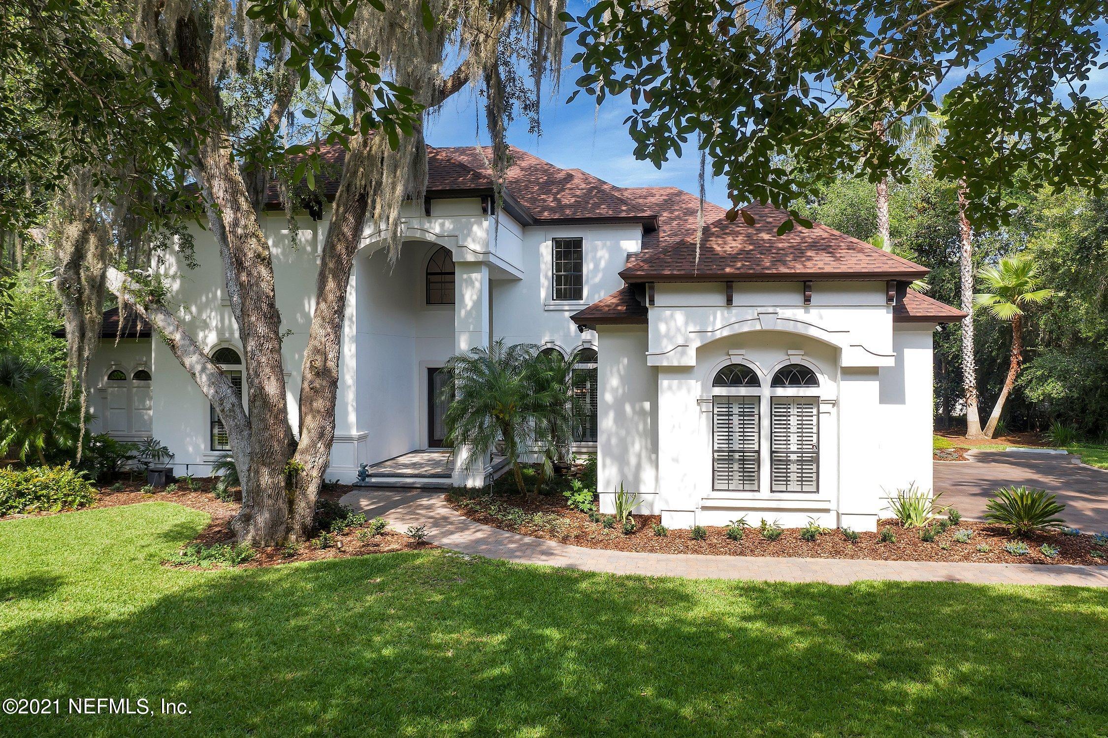 142 Marshall Creek Drive St. Augustine, FL 32095 - Photo 109 of 176 a front view of a house with a yard