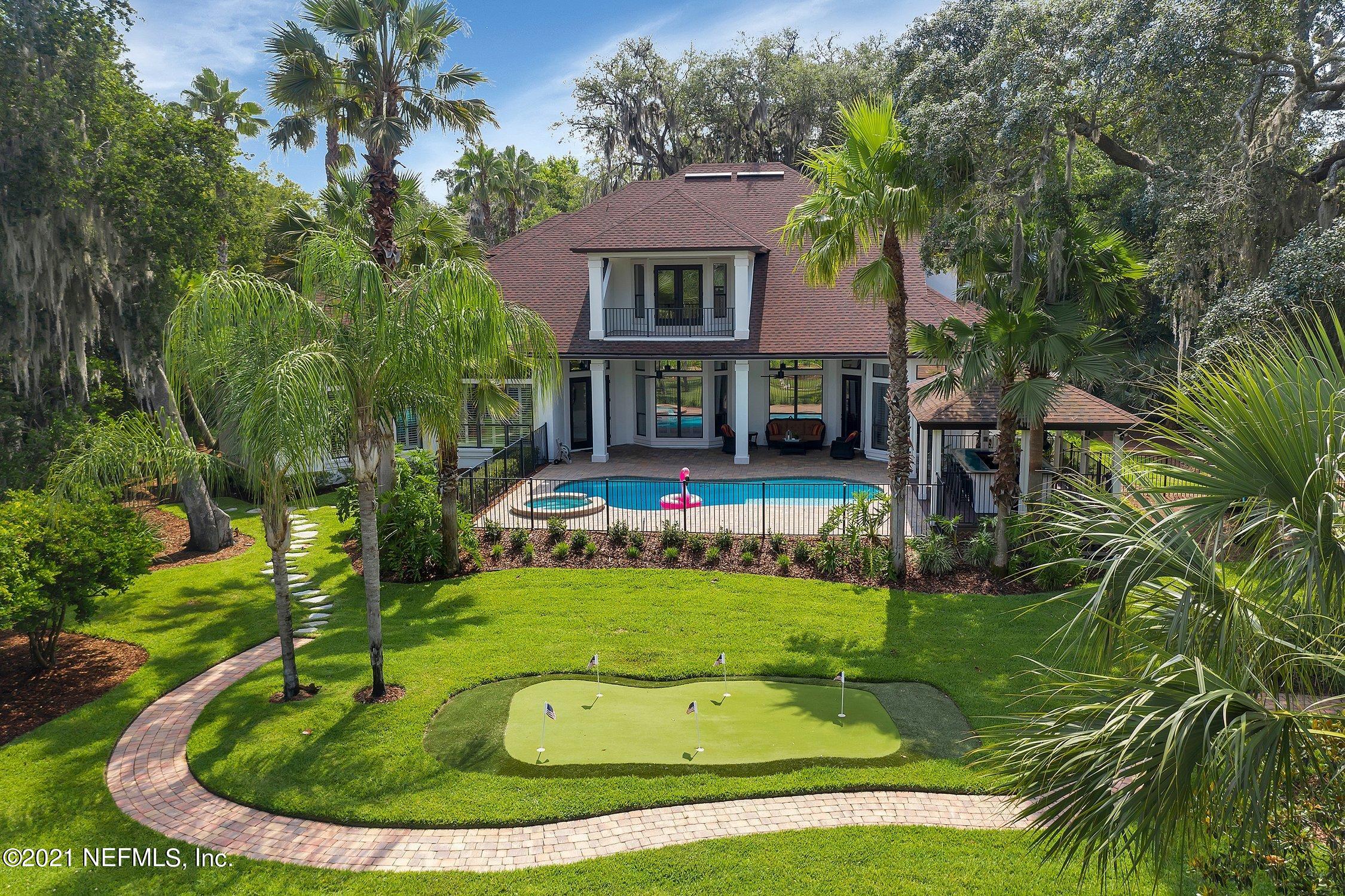 142 Marshall Creek Drive St. Augustine, FL 32095 - Photo 113 of 176 a view of a house with a swimming pool