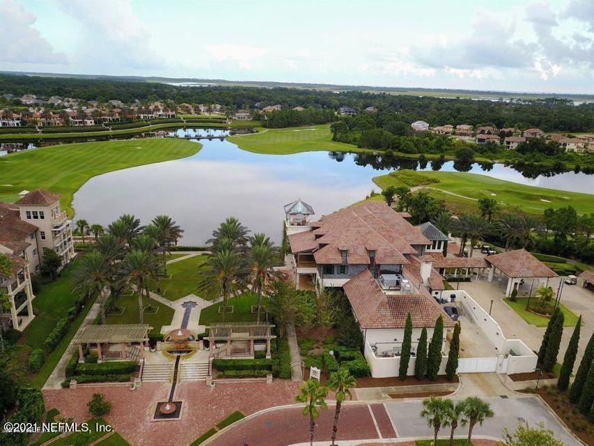 142 Marshall Creek Drive St. Augustine, FL 32095 - Photo 119 of 176 an aerial view of a city with lots of residential buildings ocean and mountain view in back