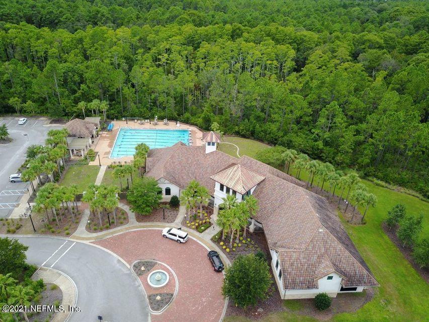 142 Marshall Creek Drive St. Augustine, FL 32095 - Photo 130 of 176 an aerial view of a house with garden space and street view