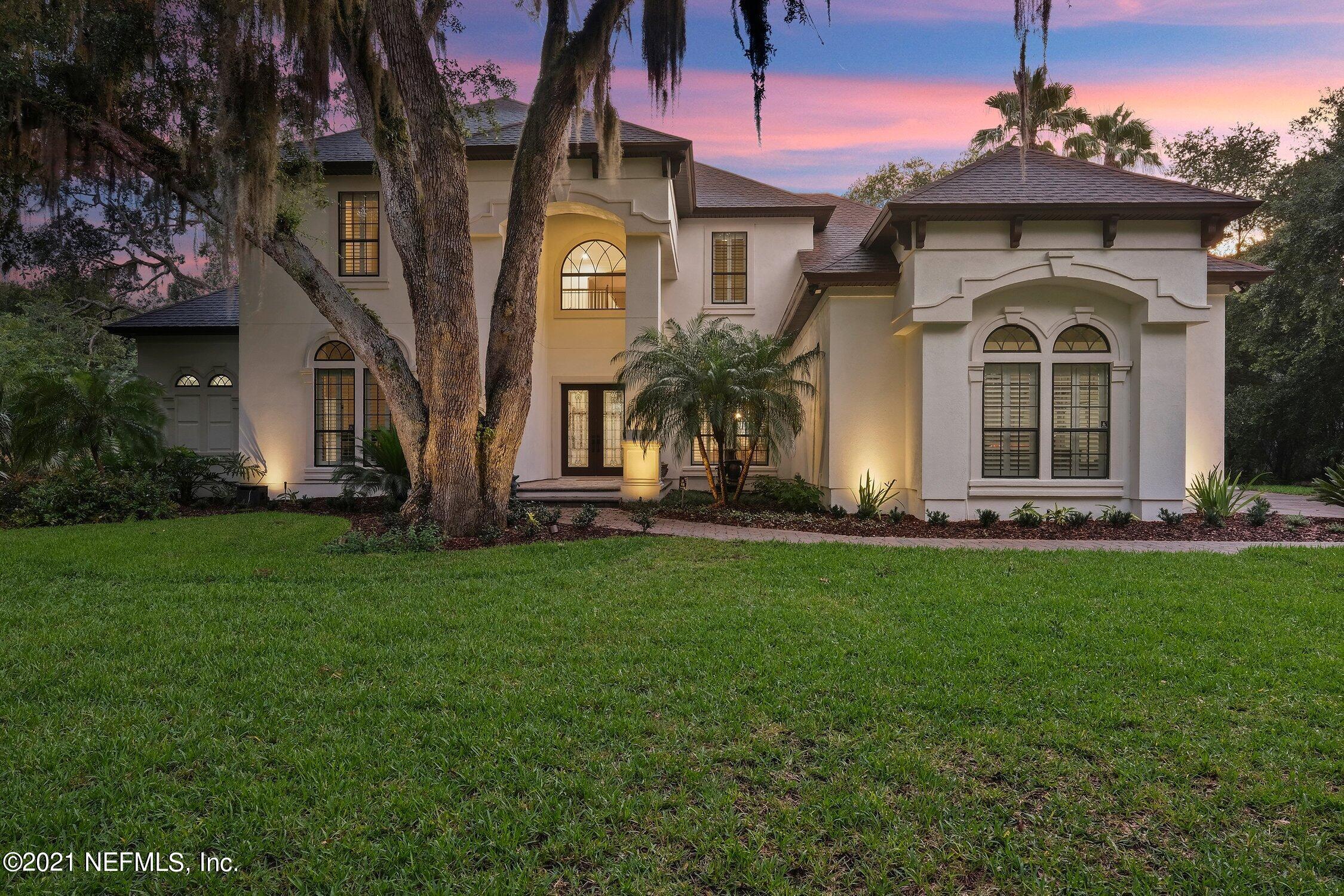 142 Marshall Creek Drive St. Augustine, FL 32095 - Photo 156 of 176 a front view of a house with a garden