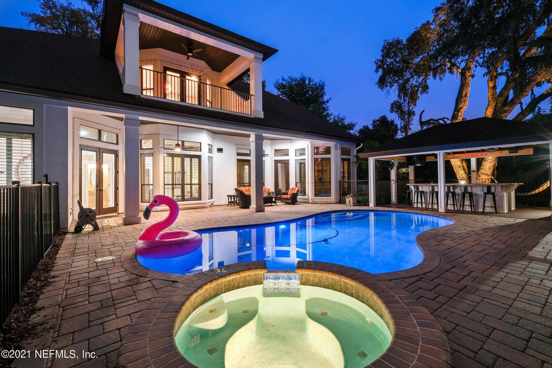 142 Marshall Creek Drive St. Augustine, FL 32095 - Photo 168 of 176 a view of a house with swimming pool and porch