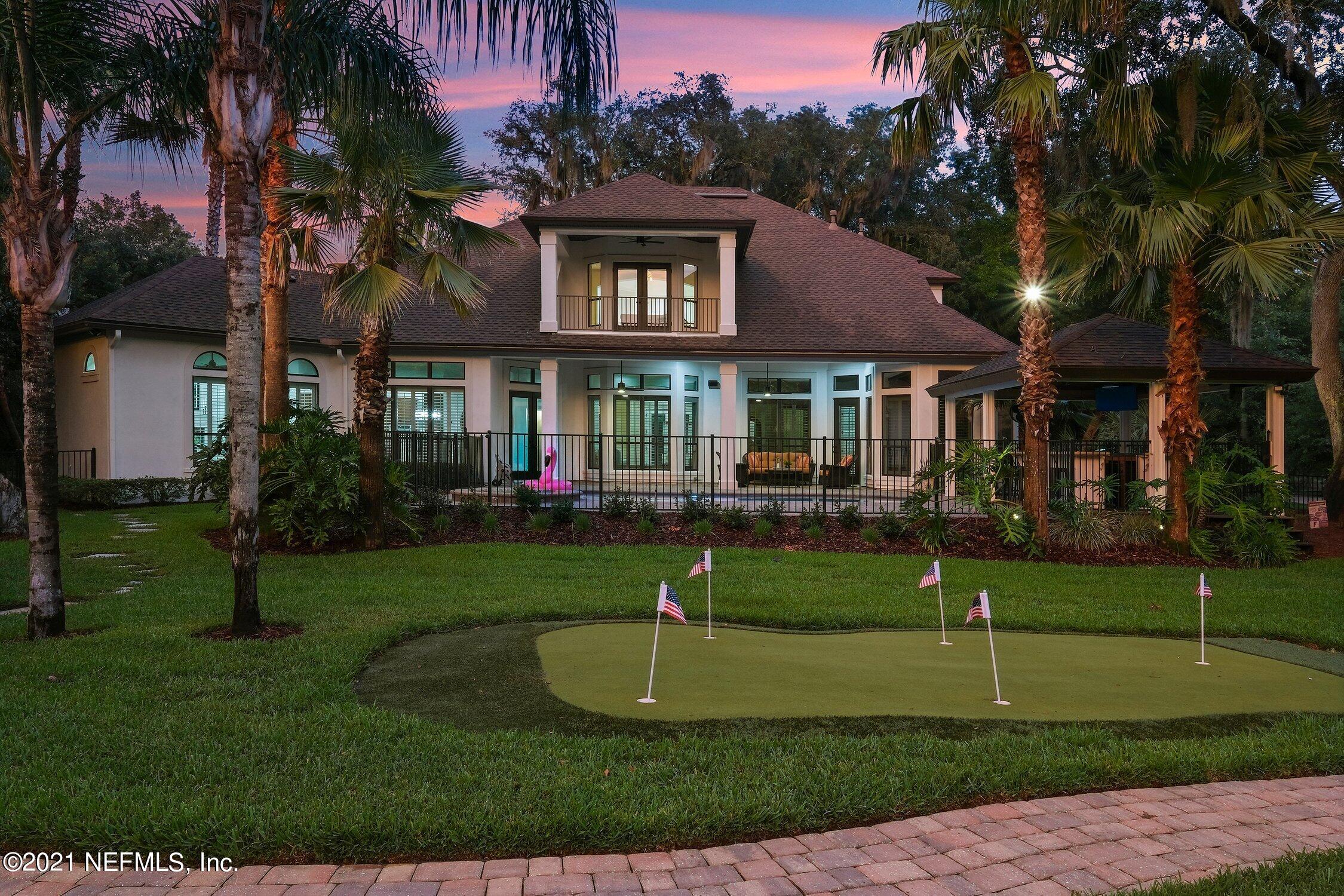 142 Marshall Creek Drive St. Augustine, FL 32095 - Photo 174 of 176 a front view of a house with a yard