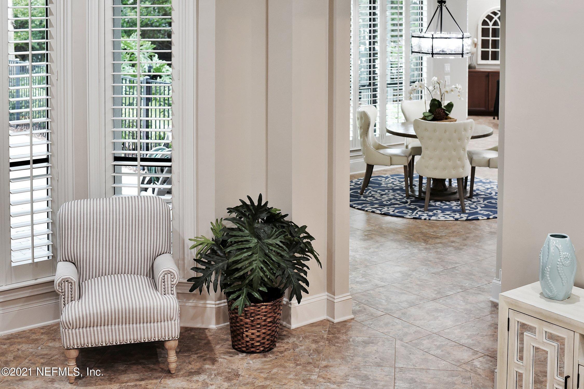 142 Marshall Creek Drive St. Augustine, FL 32095 - Photo 27 of 176 a living room with furniture and a potted plant