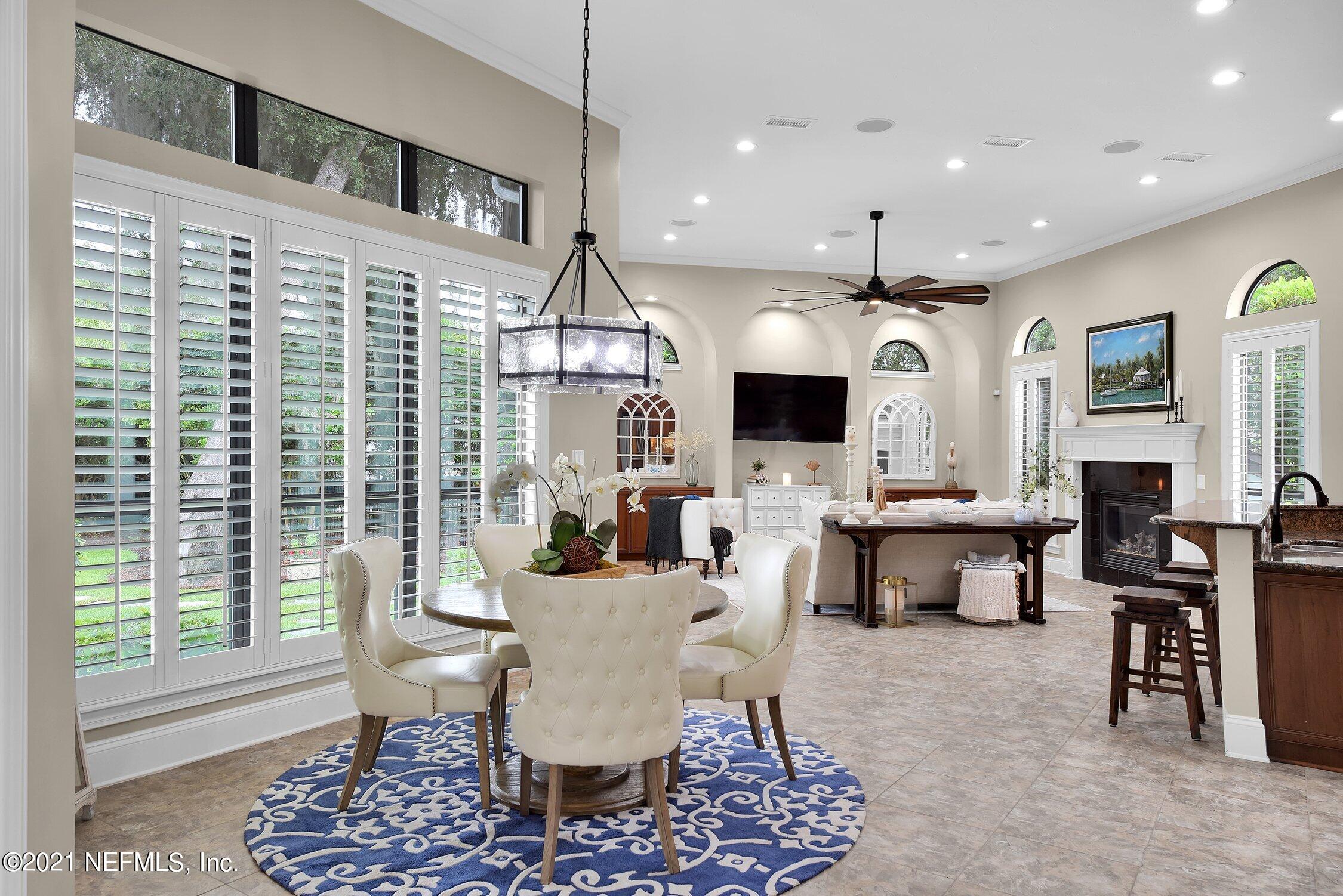 142 Marshall Creek Drive St. Augustine, FL 32095 - Photo 29 of 176 a view of a dining room with furniture window and wooden floor