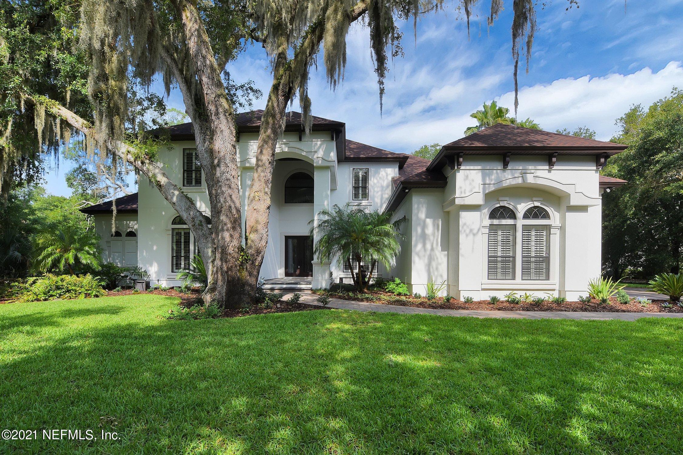 142 Marshall Creek Drive St. Augustine, FL 32095 - Photo 5 of 176 a front view of a house with a yard