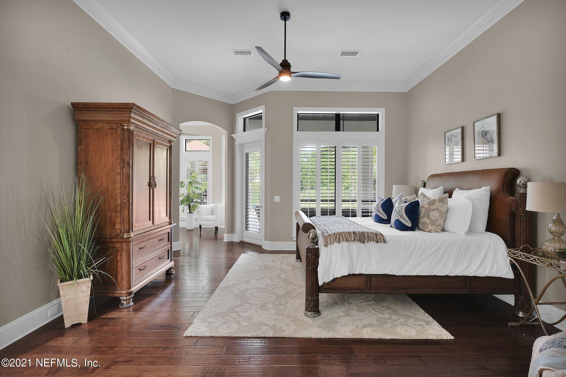 142 Marshall Creek Drive St. Augustine, FL 32095 - Photo 52 of 176 a living room with furniture large window and wooden floor