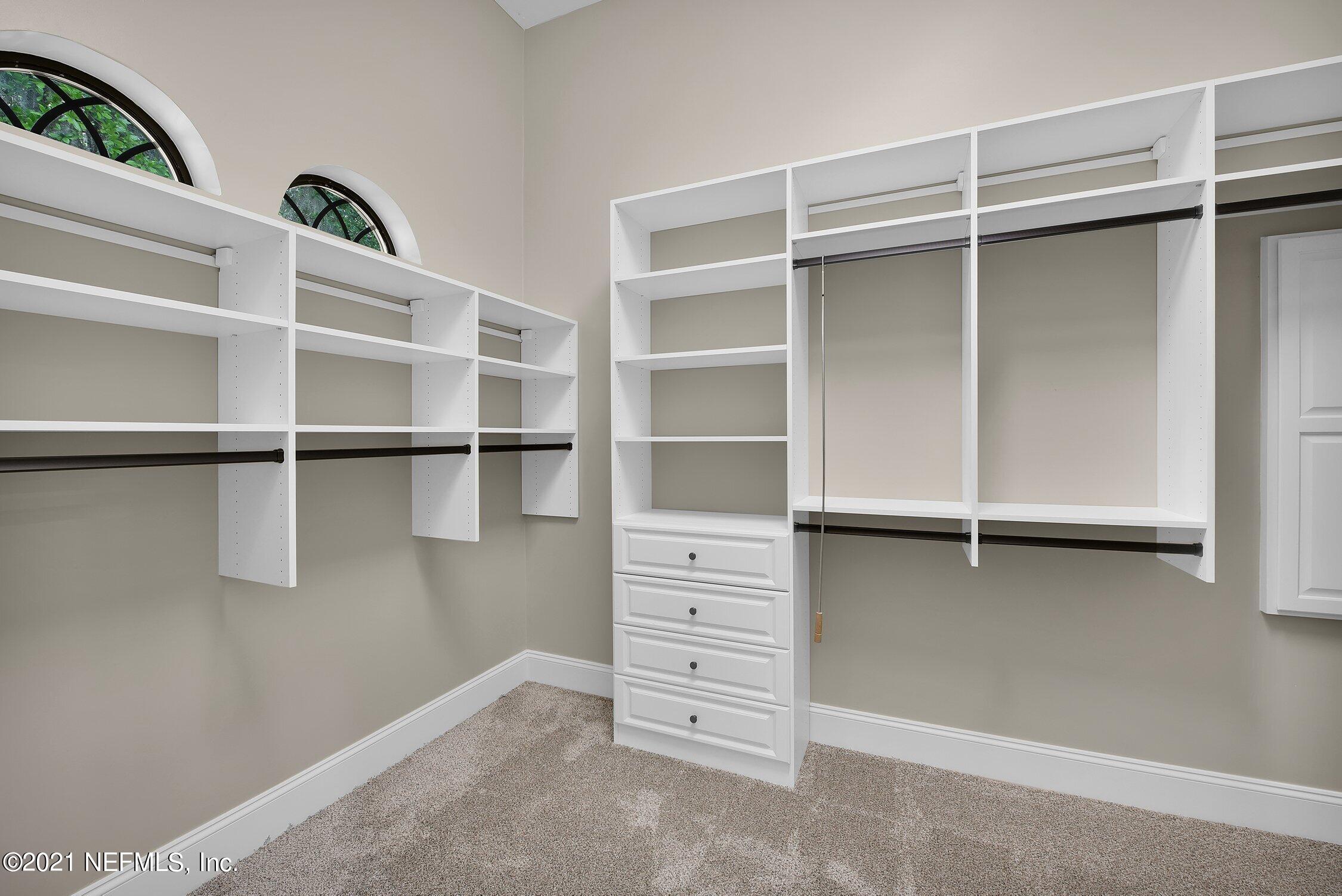 142 Marshall Creek Drive St. Augustine, FL 32095 - Photo 60 of 176 a view of walk in closet with empty racks