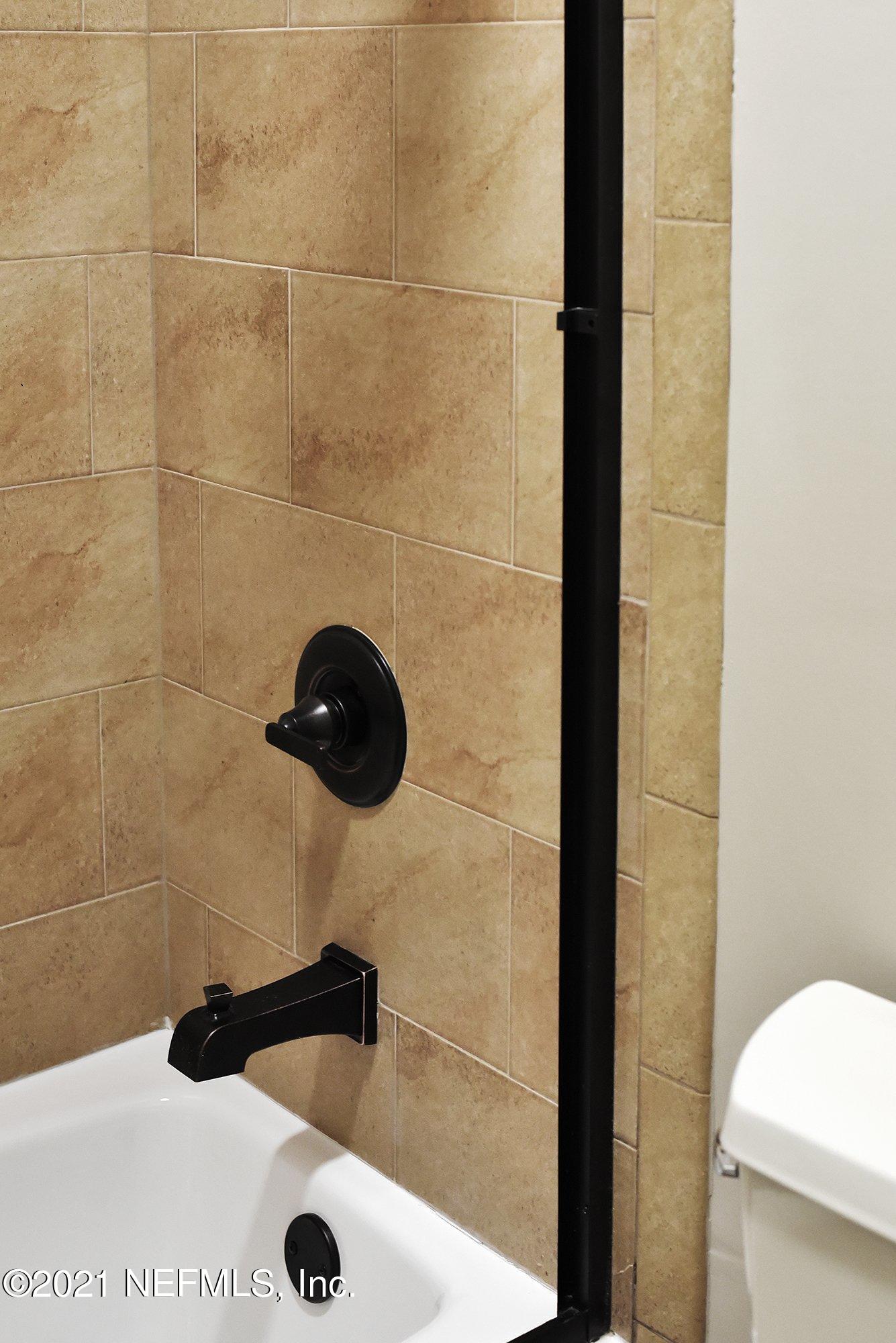 142 Marshall Creek Drive St. Augustine, FL 32095 - Photo 78 of 176 a bathroom with a sink a toilet and shower