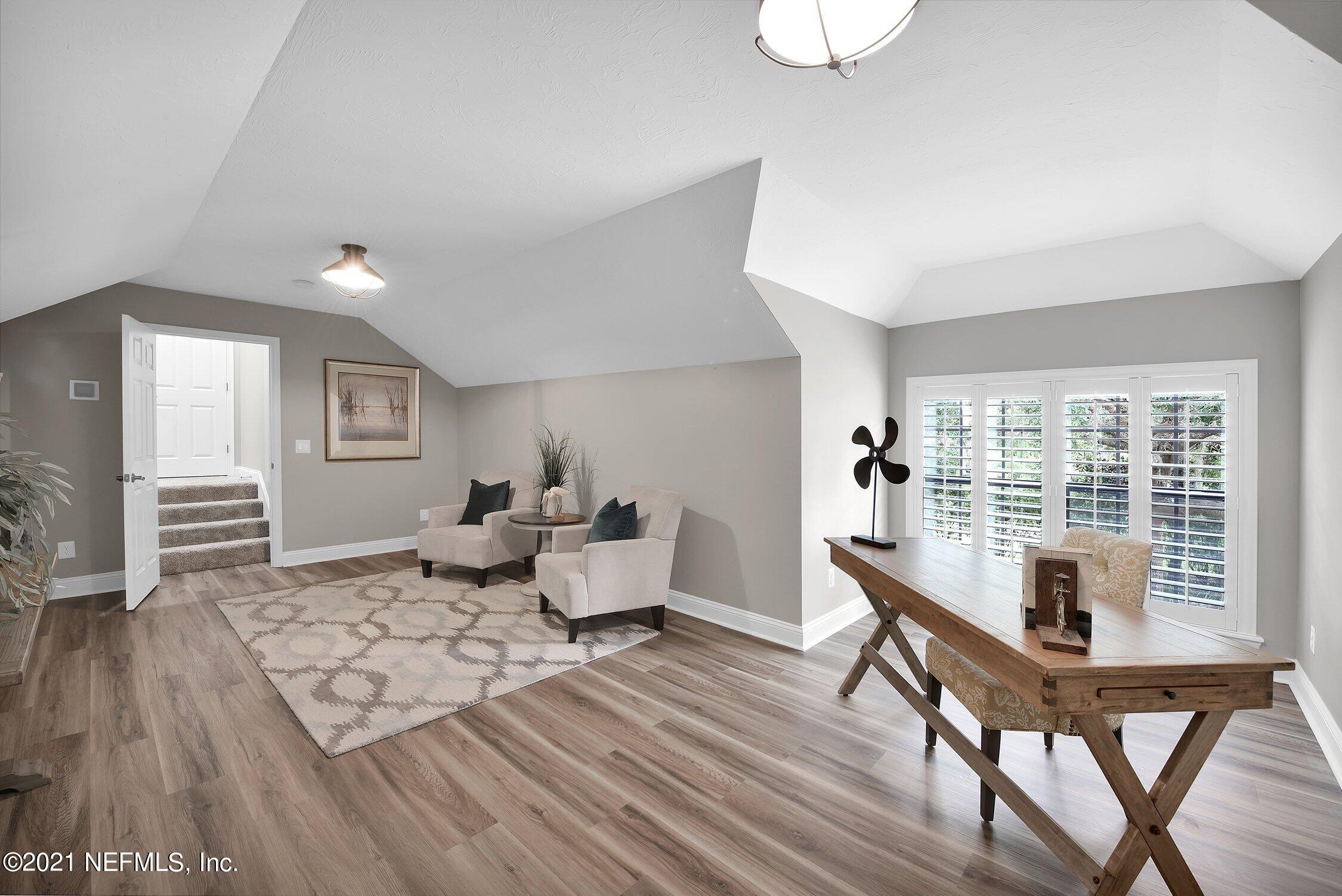 142 Marshall Creek Drive St. Augustine, FL 32095 - Photo 86 of 176 a living room with furniture and a wooden floor
