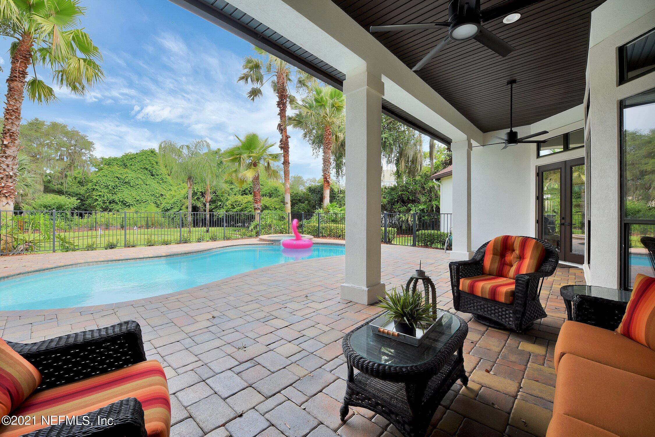 142 Marshall Creek Drive St. Augustine, FL 32095 - Photo 88 of 176 a living room with patio furniture and a potted plant