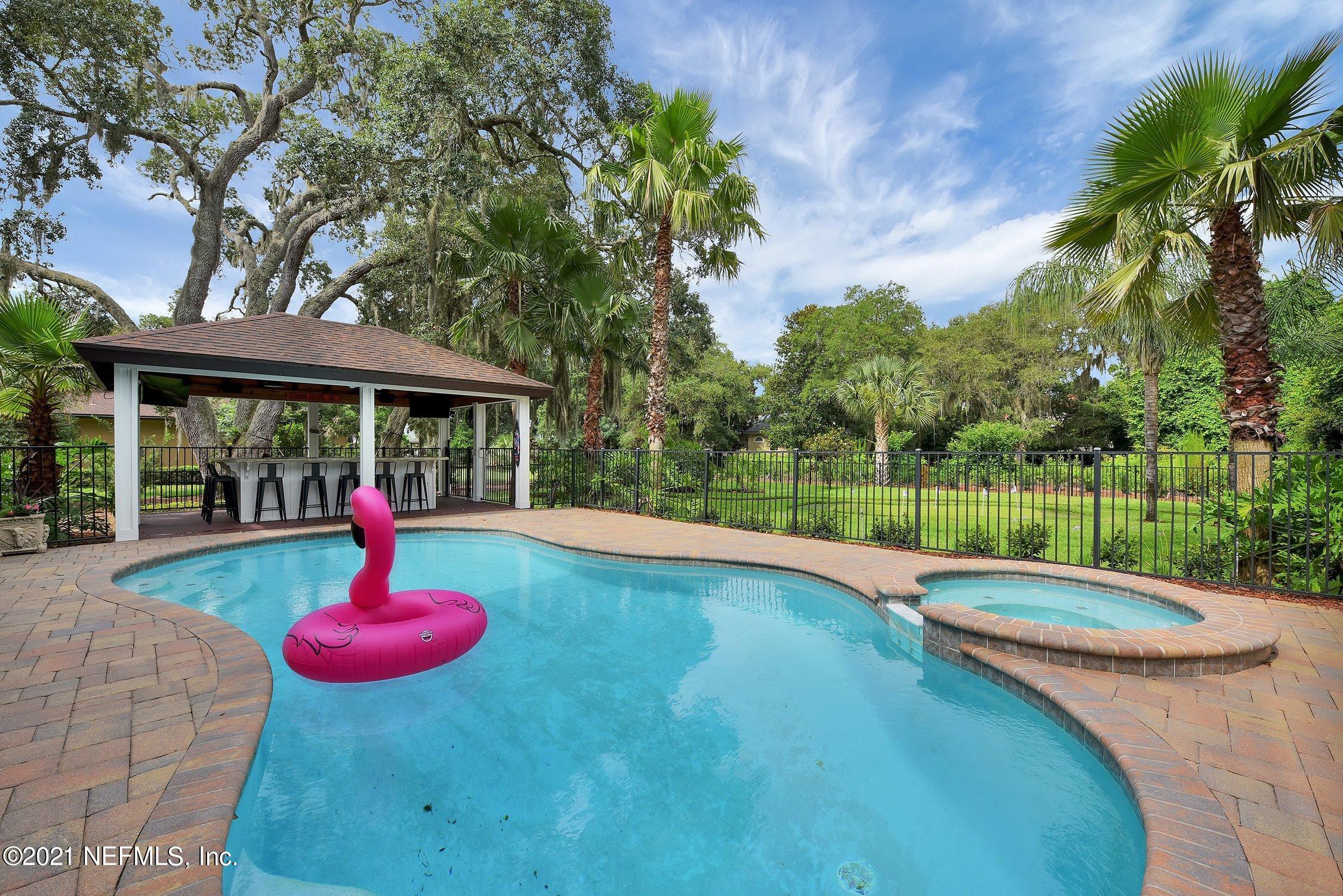 142 Marshall Creek Drive St. Augustine, FL 32095 - Photo 96 of 176 a view of a swimming pool with a yard