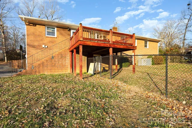 a view of a house with large windows