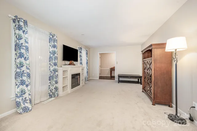 a view of a livingroom with furniture and a fireplace
