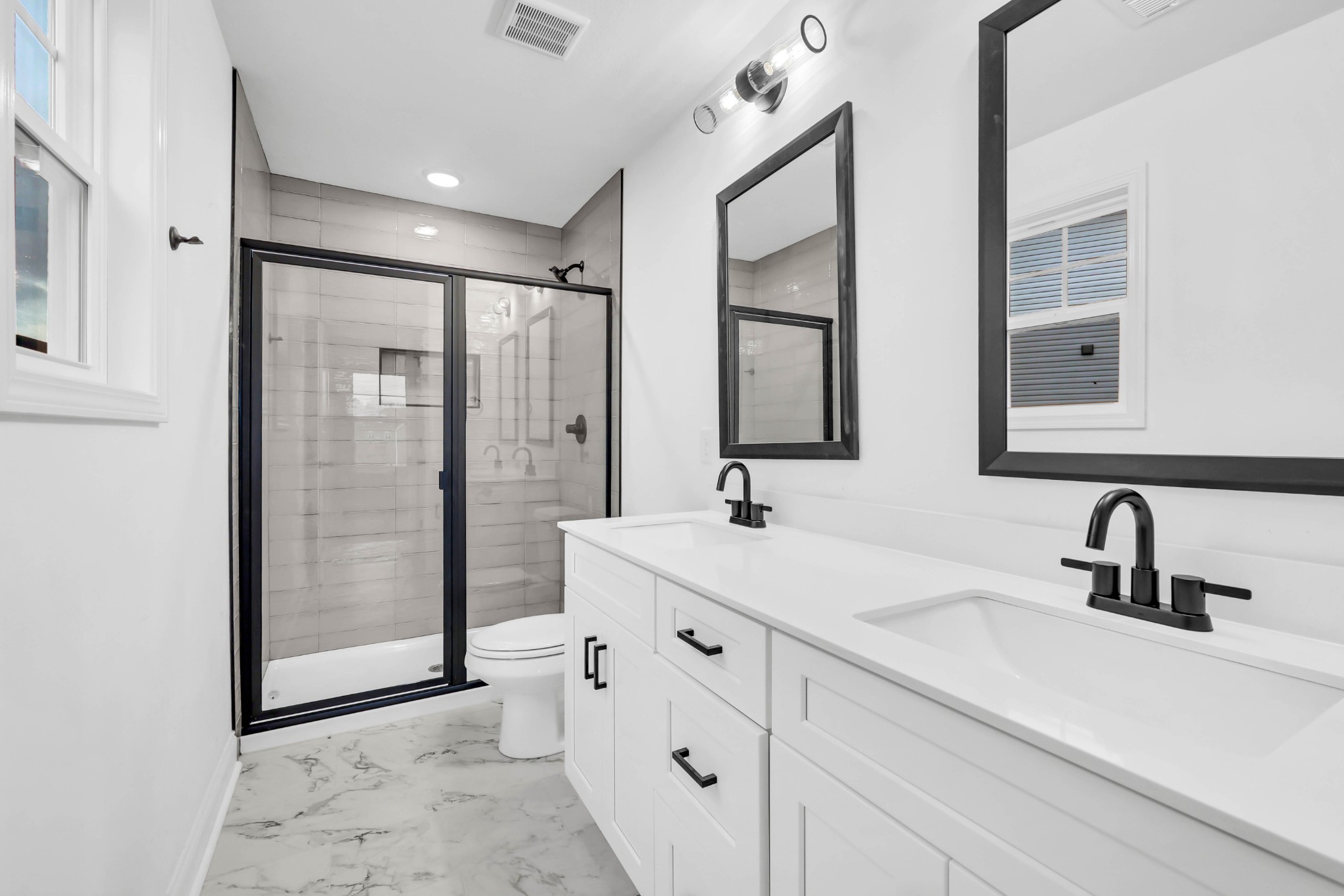 187 Quarry View Clarksville, TN 37043 - Photo 20 of 36 a bathroom with double vanity sink a mirror a glass door a shower and vanity