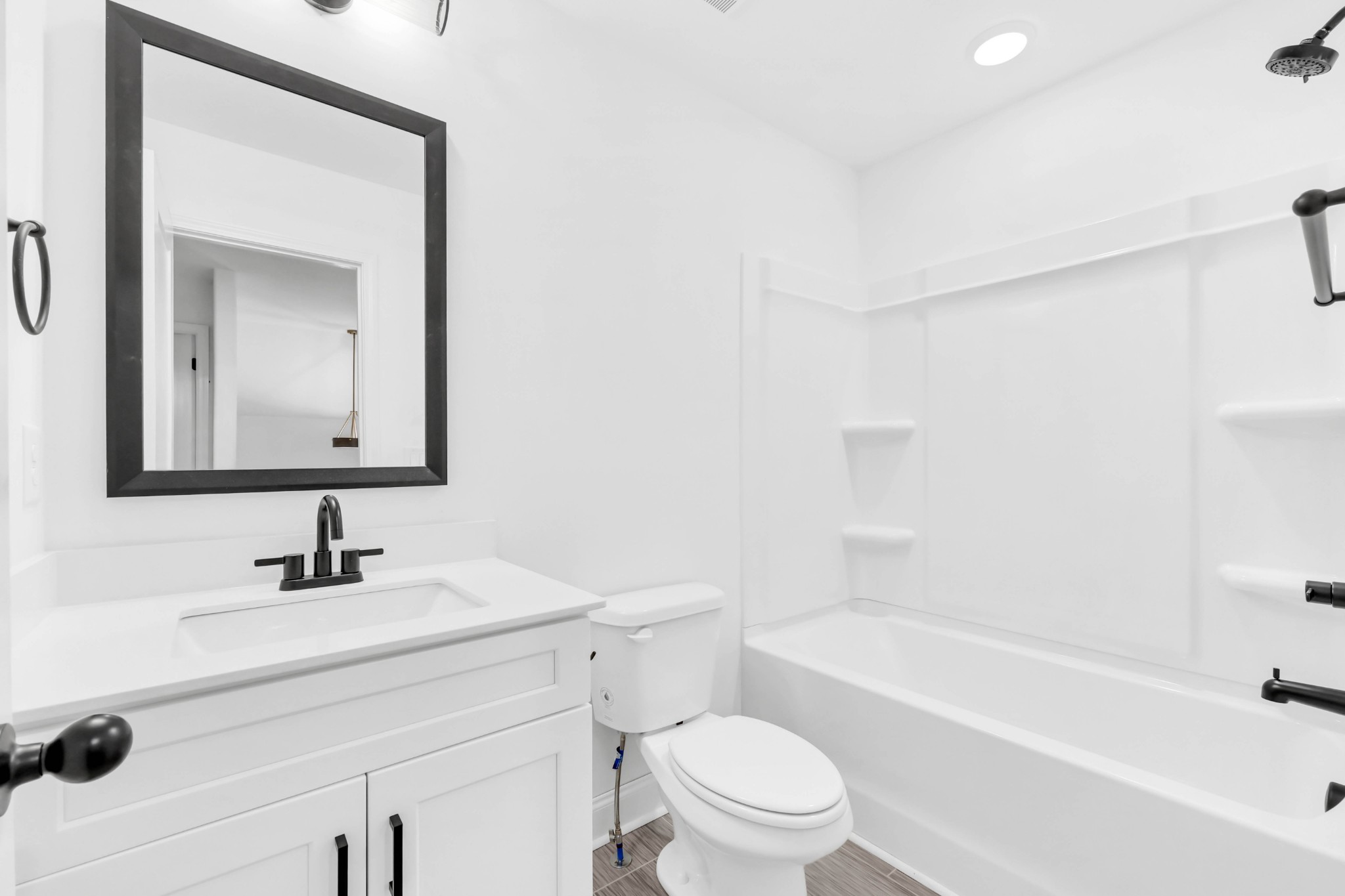 187 Quarry View Clarksville, TN 37043 - Photo 25 of 36 a bathroom with a toilet a sink a mirror and bathtub