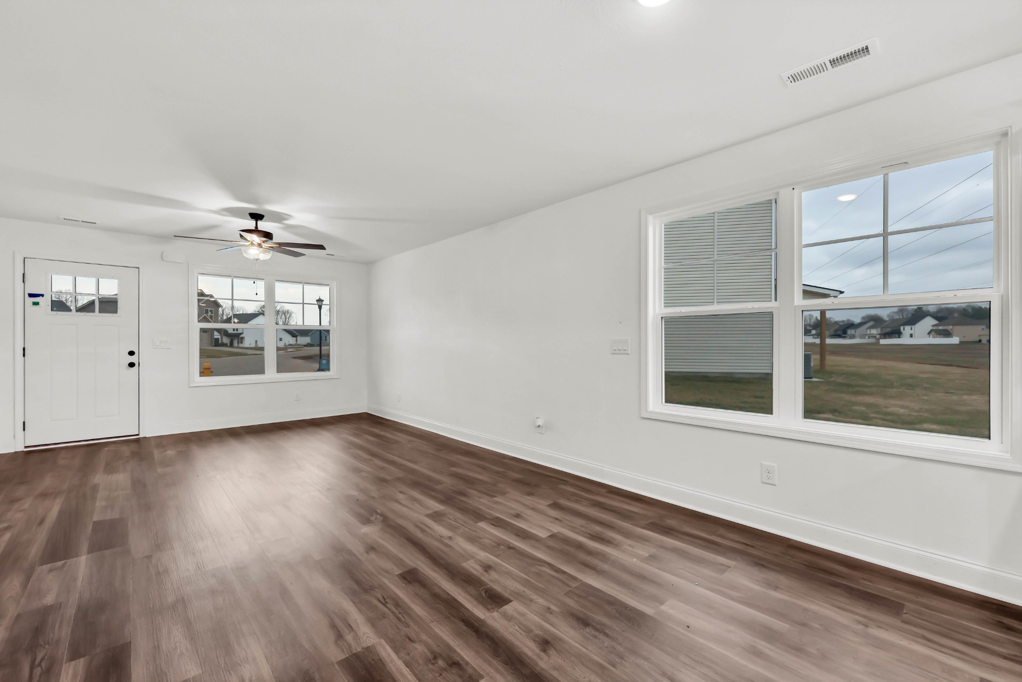187 Quarry View Clarksville, TN 37043 - Photo 5 of 36 a view of an empty room with a window and wooden floor