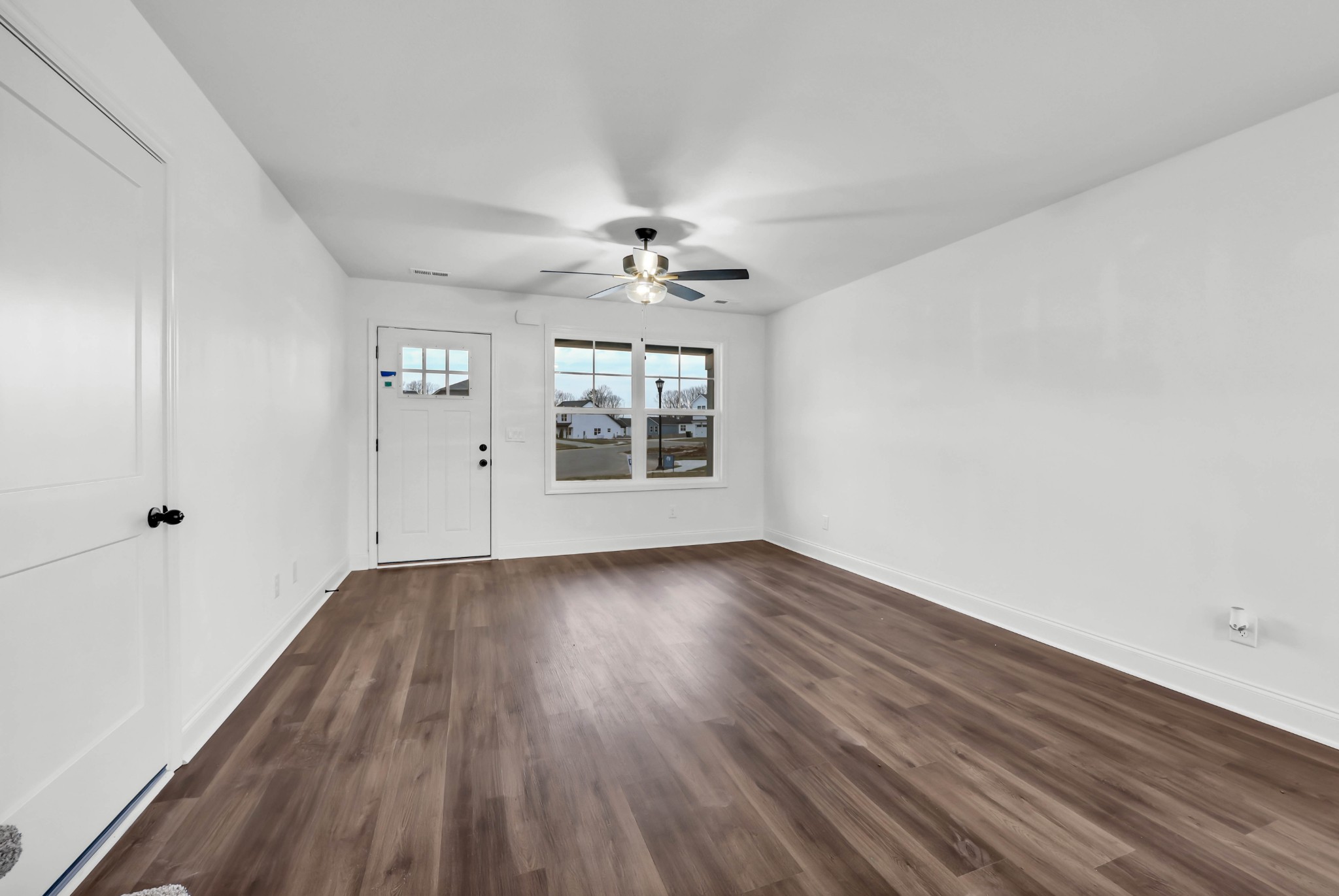 187 Quarry View Clarksville, TN 37043 - Photo 6 of 36 wooden floor in an empty room with a window
