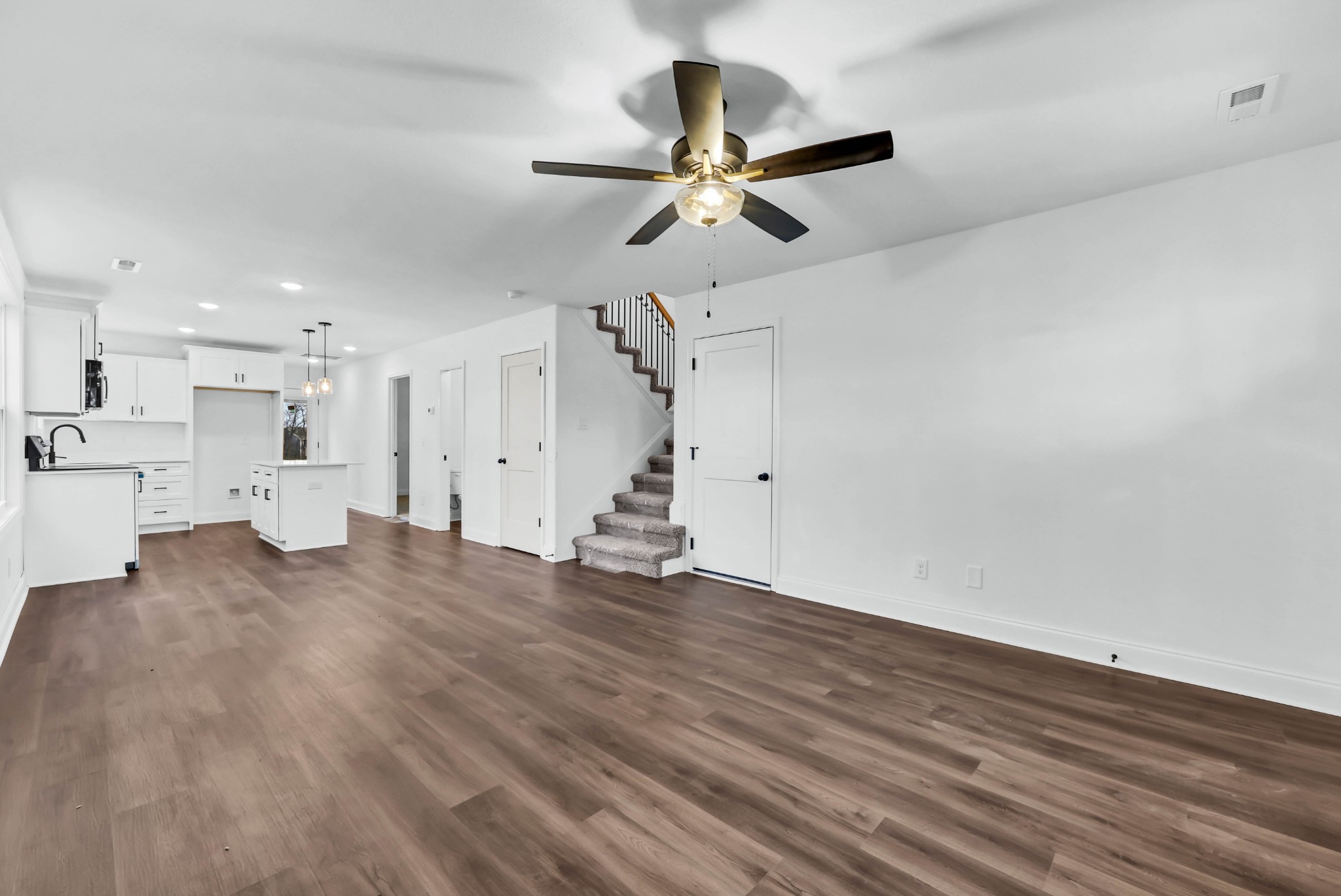 187 Quarry View Clarksville, TN 37043 - Photo 7 of 36 a view of empty room with wooden floor and ceiling fan