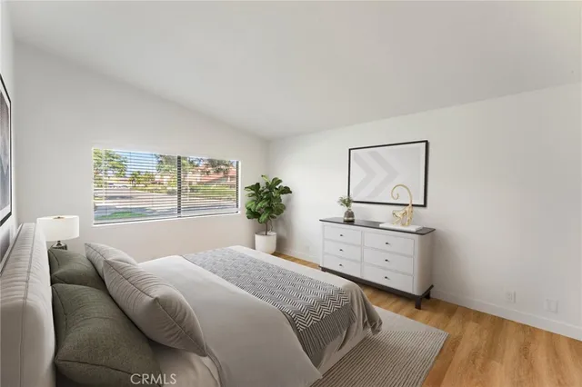 a bedroom with a bed and a dresser