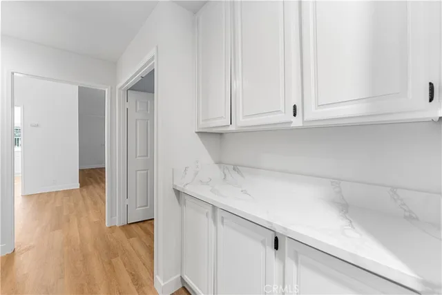 a view of cabinets with wooden floor