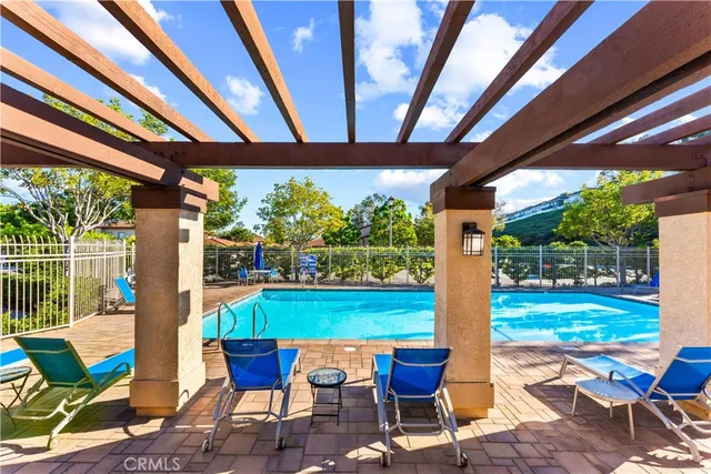 a view of swimming pool with outdoor seating
