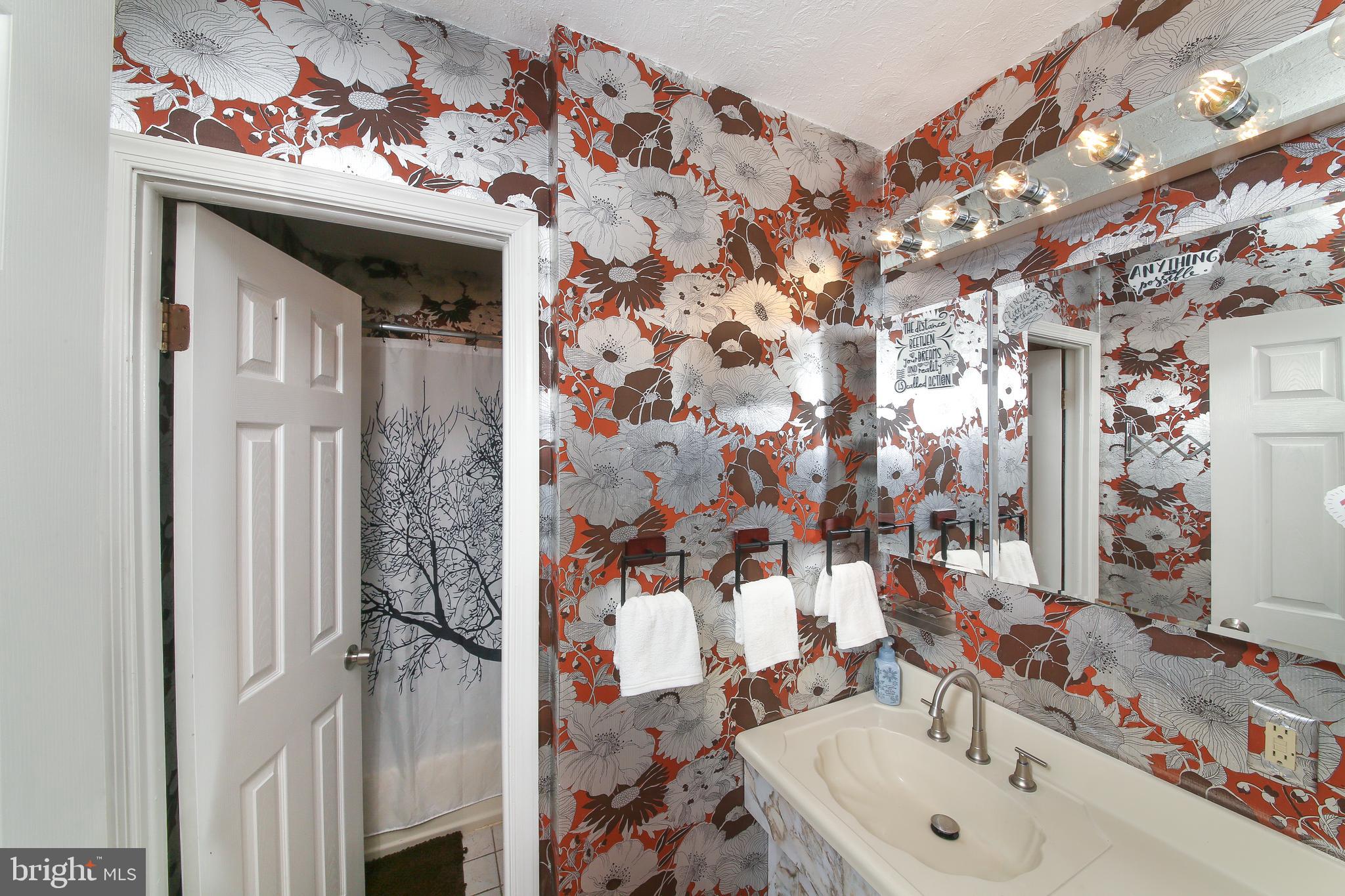 712 Mourning Dove Road Audubon, PA 19403 - Photo 13 of 27 Full bath with floral foil wallpaper