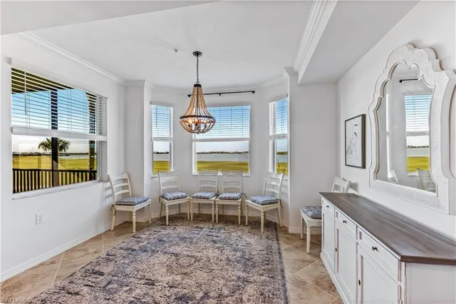 a large room with lots of wooden furniture and windows