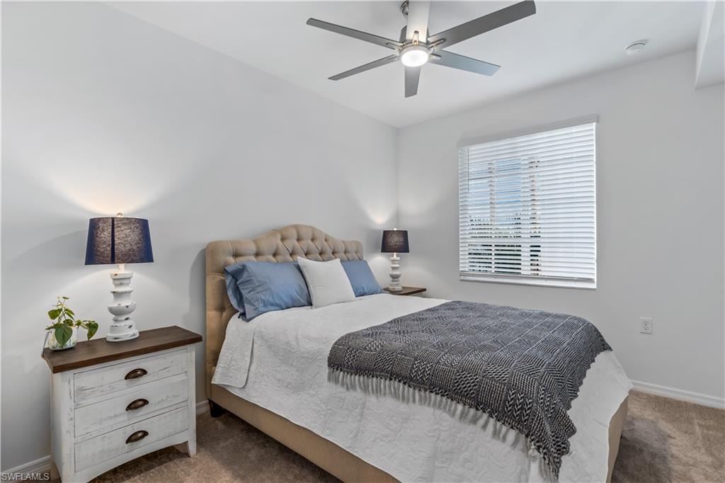 43030 Greenway Boulevard, Unit 423 Babcock Ranch, FL 33982 - Photo 9 of 11 a bedroom with a bed and a window