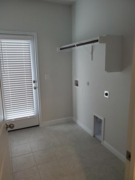 6404 Gunflint Drive Austin, TX 78747 - Photo 11 of 21 A well-appointed utility room features tile flooring and convenient laundry hookups.