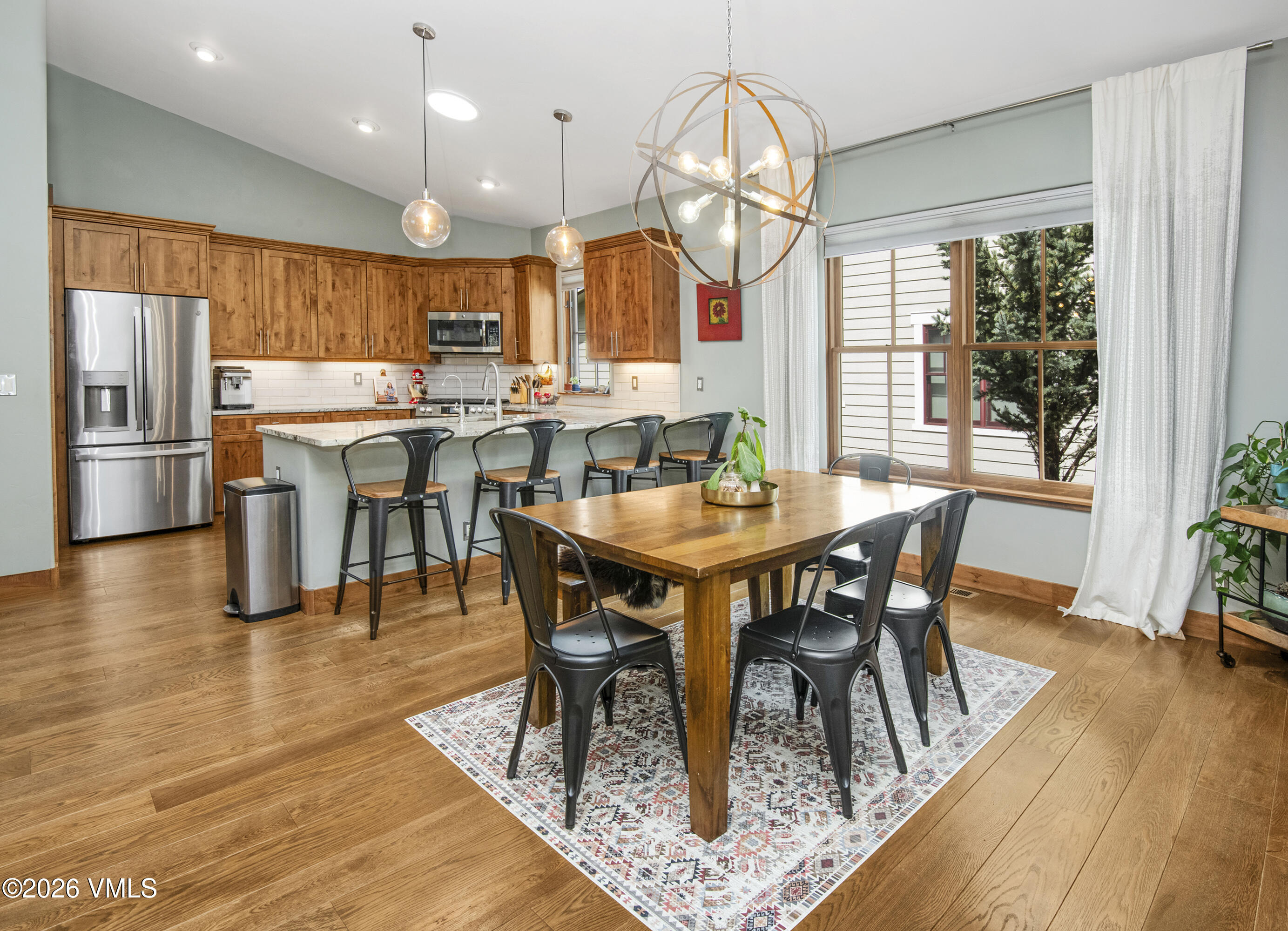 135 Palmer Loop Eagle, CO 81631 - Photo 17 of 54 an open kitchen with wooden floor and stainless steel appliances