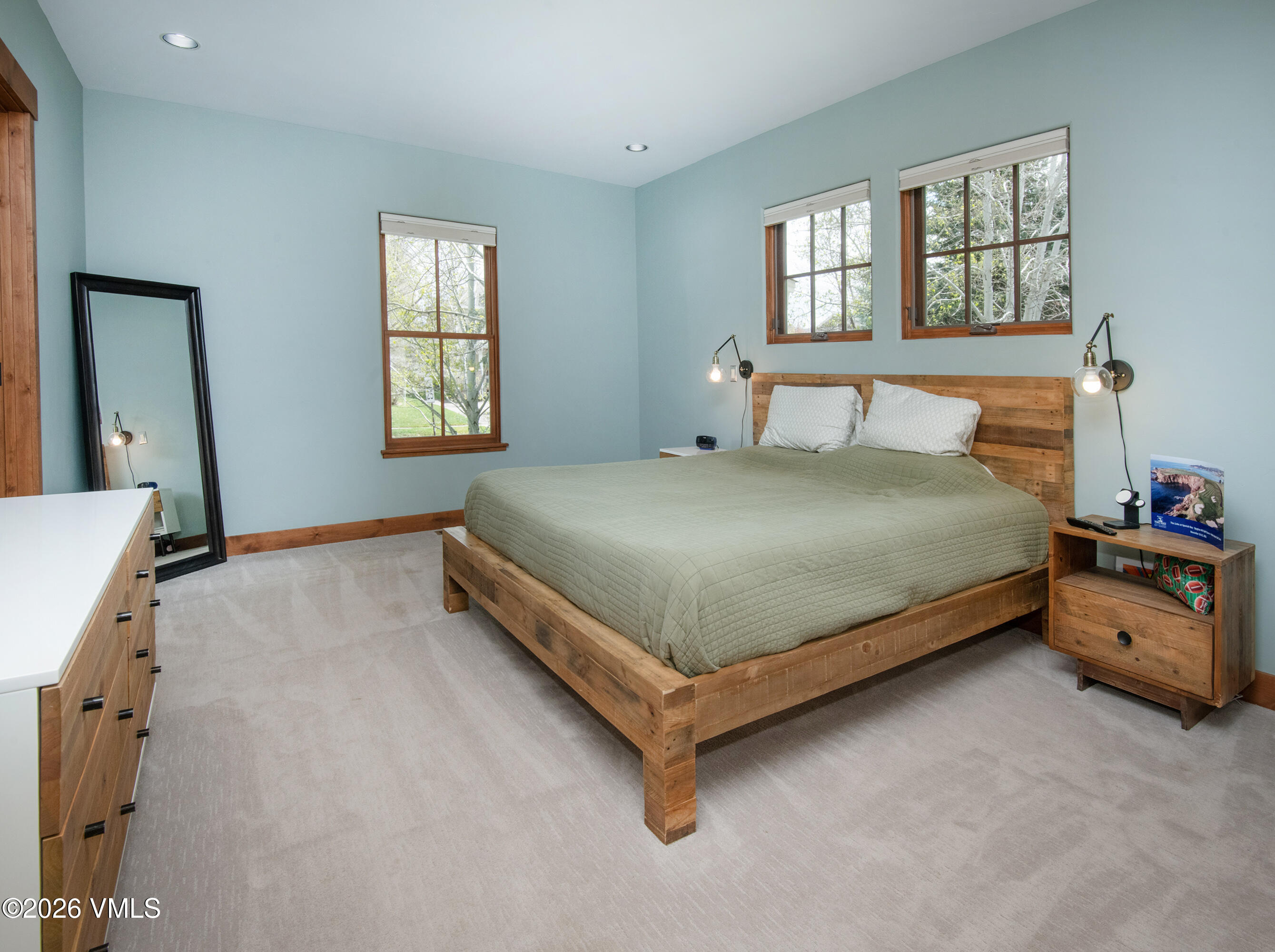 135 Palmer Loop Eagle, CO 81631 - Photo 24 of 54 a bed sitting in a bedroom next to a window