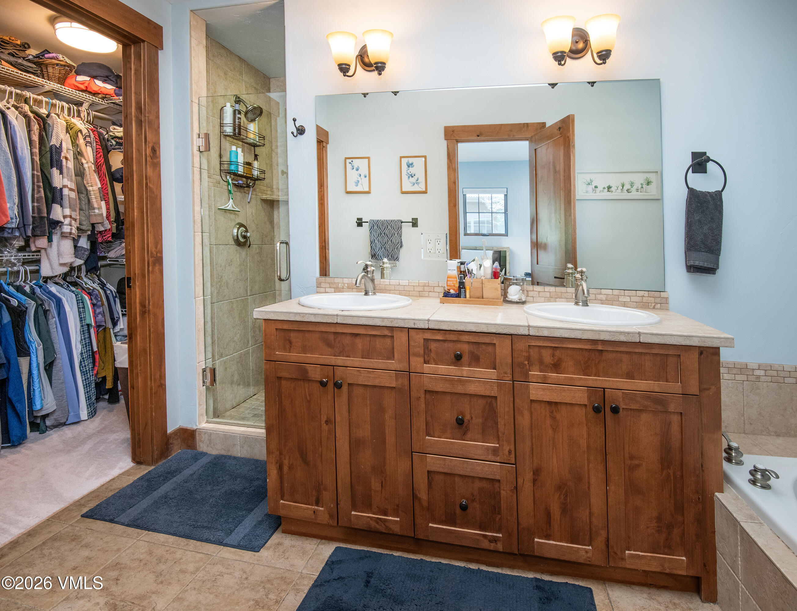 135 Palmer Loop Eagle, CO 81631 - Photo 25 of 54 a bathroom with a sink vanity and a mirror