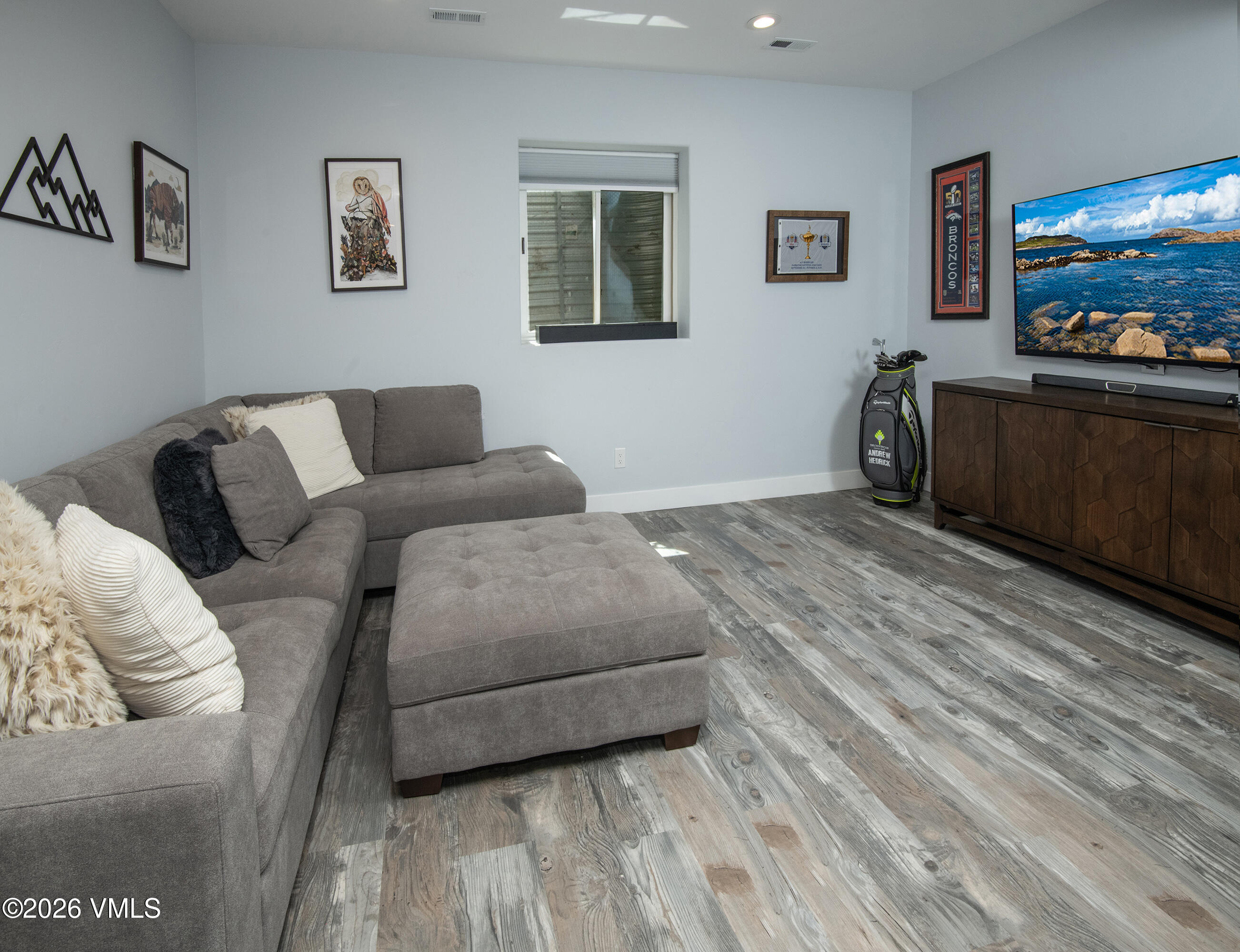 135 Palmer Loop Eagle, CO 81631 - Photo 34 of 54 a living room with furniture and a flat screen tv