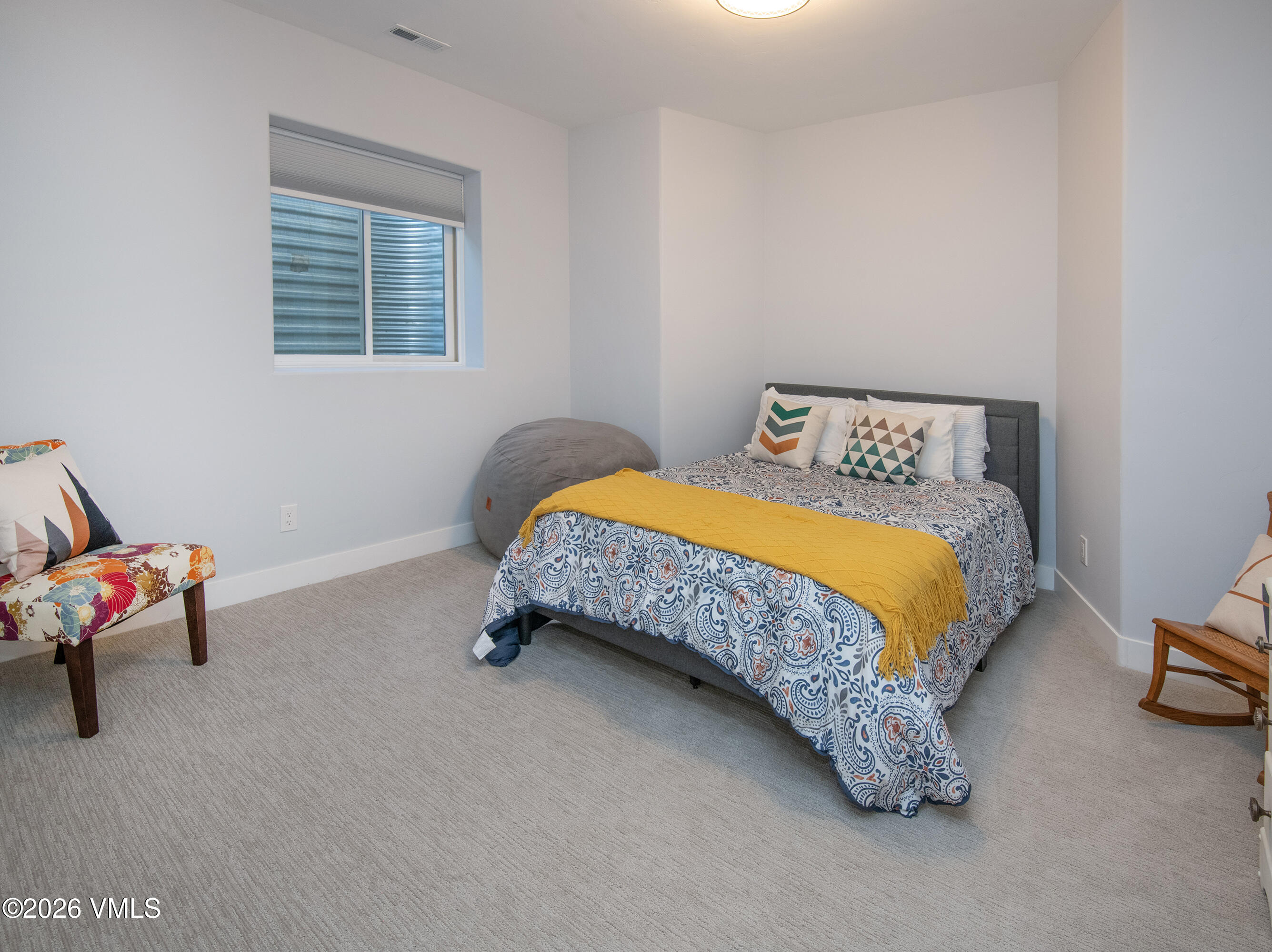135 Palmer Loop Eagle, CO 81631 - Photo 38 of 54 a bedroom with a bed and a couch