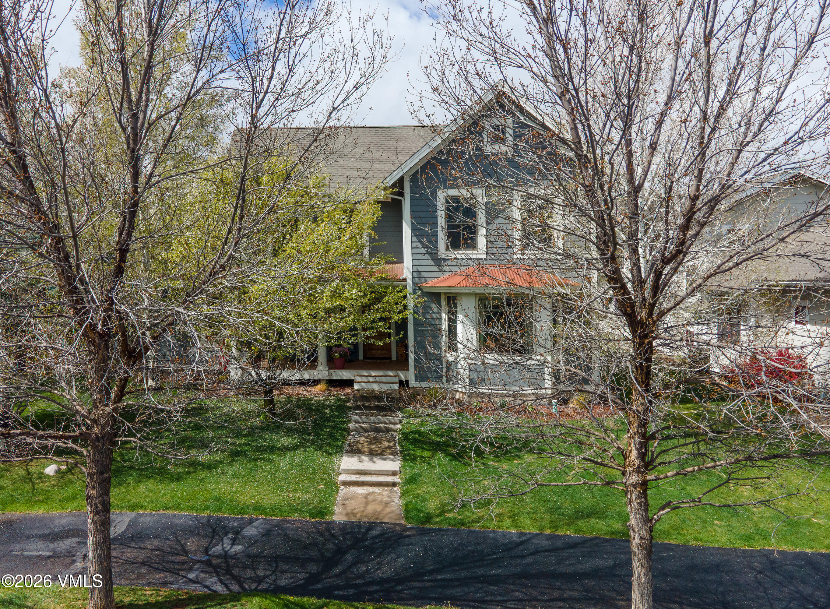 135 Palmer Loop Eagle, CO 81631 - Photo 47 of 54 a front view of a house with garden